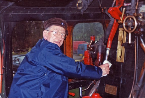Boris's friend, former Grantham fireman Alfred 'Wigg' Dickinson, on the Great Central Railway with No.4472 'Flying Scotsman'. Alf has a 'white un' in his right hand around the regulator handle - a white cloth as used by George in the story. Lent by Boris Bennett.